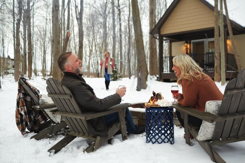 Couple enjoying a campfire together