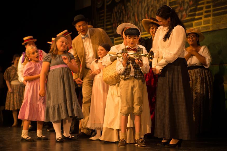 Cast on stage at Holmes Center for the Arts