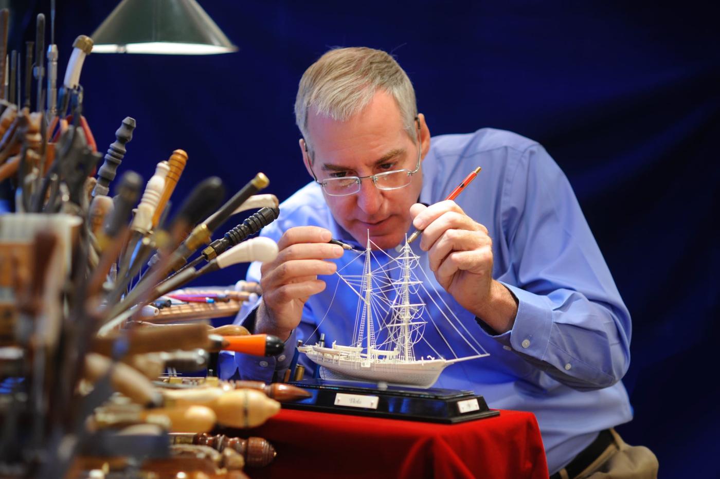 David Warther carving one of his ships from ivory